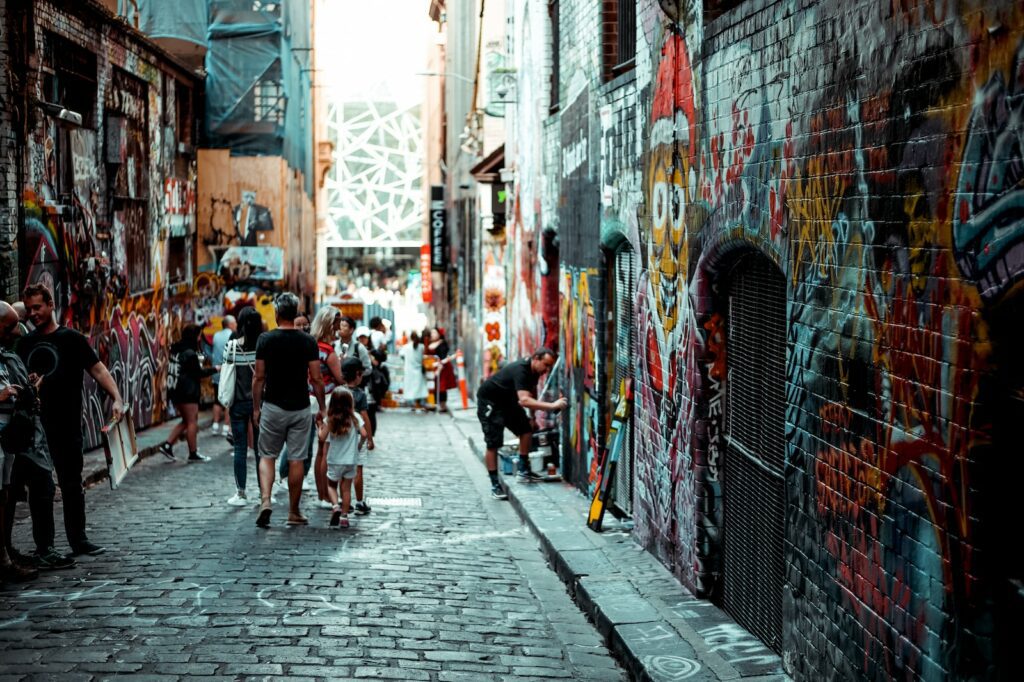 man and girl walking beside building