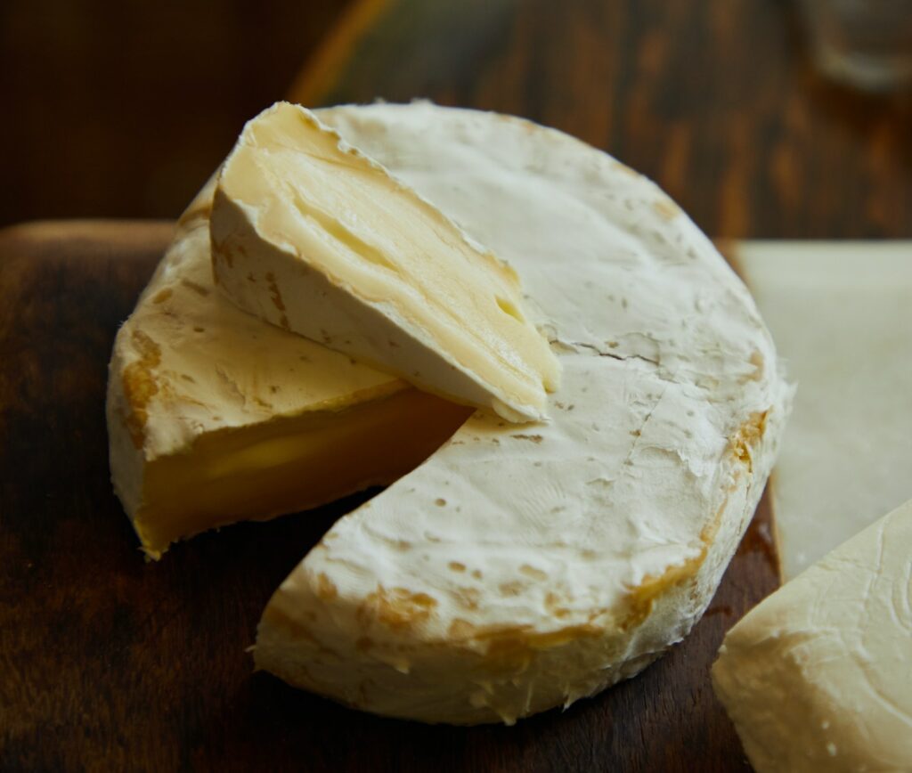 Close up of a Camembert Cheese on Wooden Table