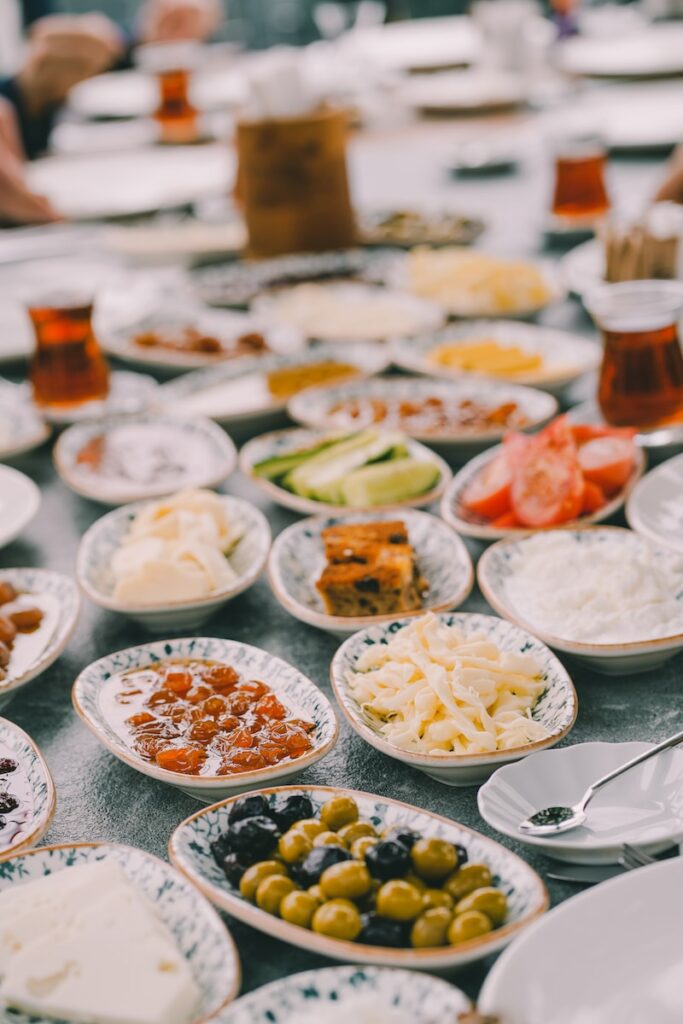 a table topped with lots of plates of food