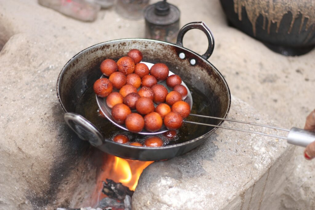 red round fruits in black cooking pan