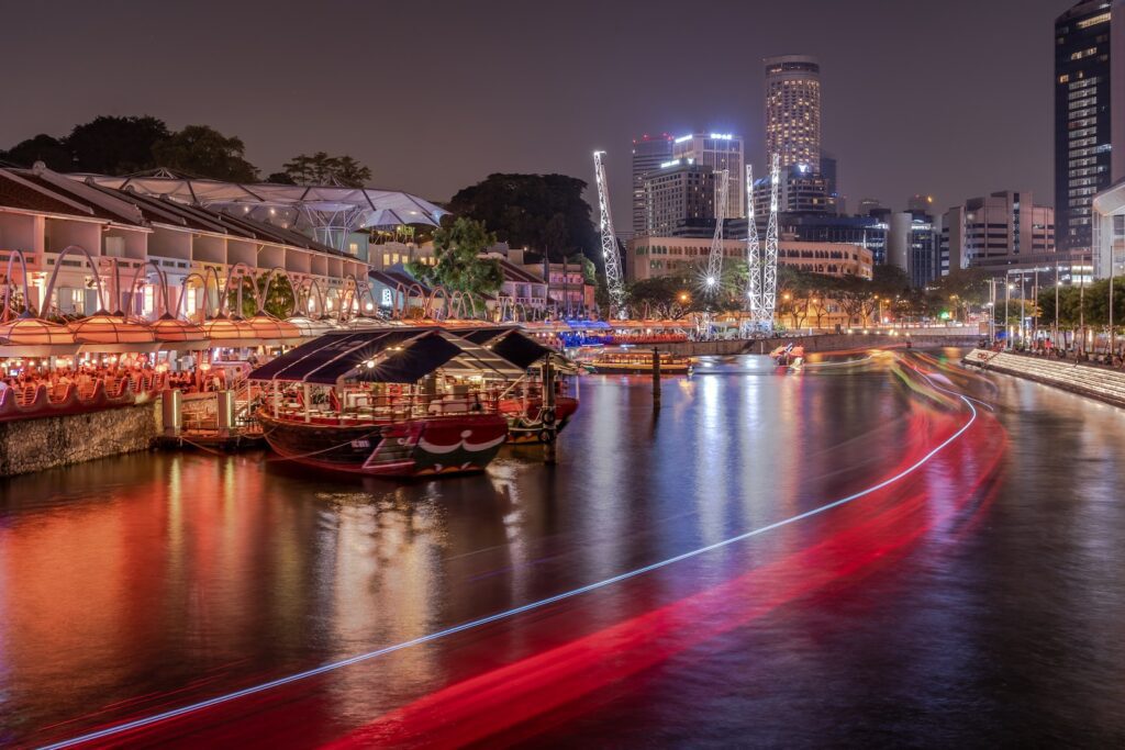 red and brown boat on river during night time